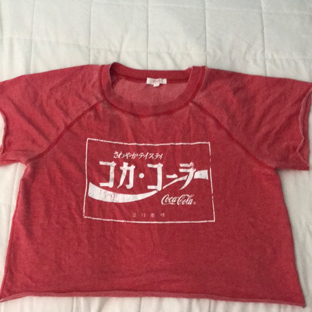 Never worn, red, coca-cola shirt.